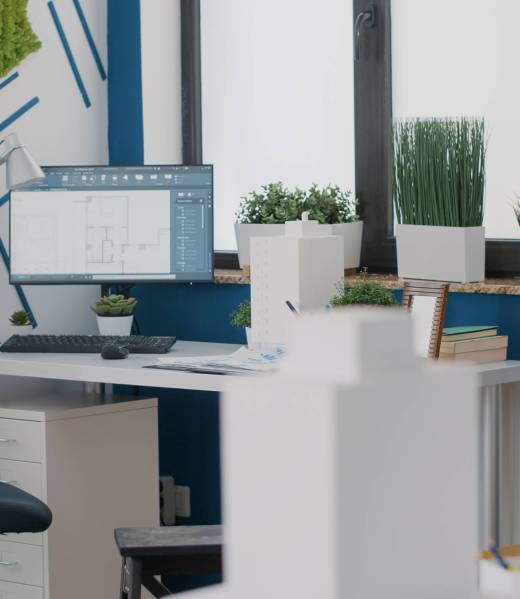Close up of desk in architectural office with digital blueprints plans on computer. Monitor with sketch presentation for building layout and structure. Architecture urban project